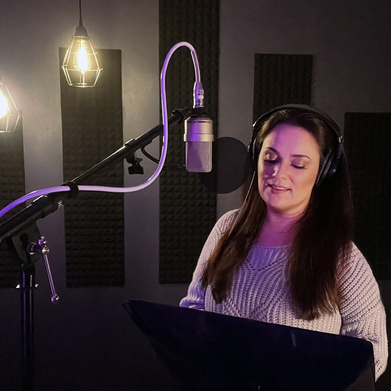 Catherine Provenza recording a professional commercial voiceover session in home studio