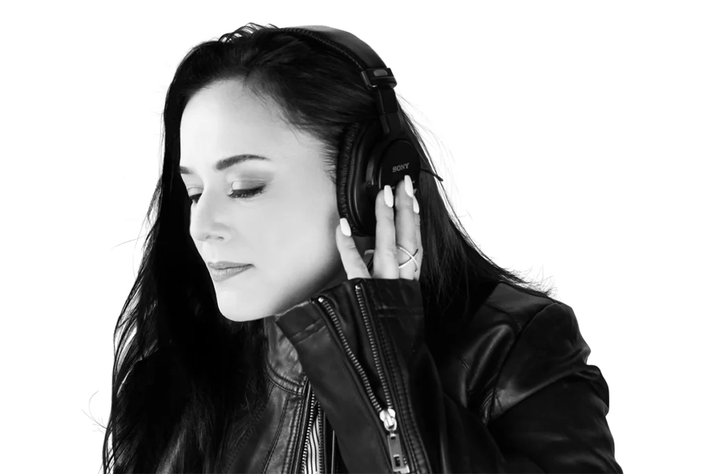 Catherine Provenza - professional female voiceover artist wearing studio headphones