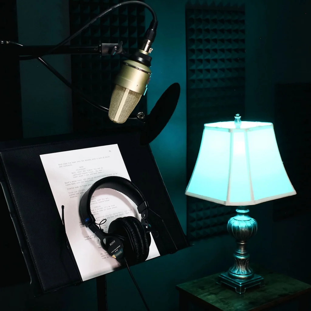 Catherine Provenza professional female voiceover artist in teal neon-lit recording studio